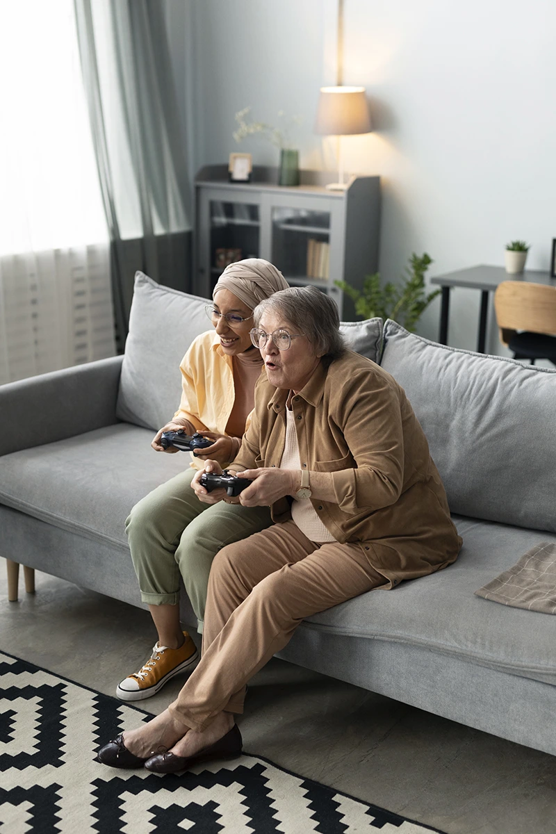 image of a caretaker playing video games with their client